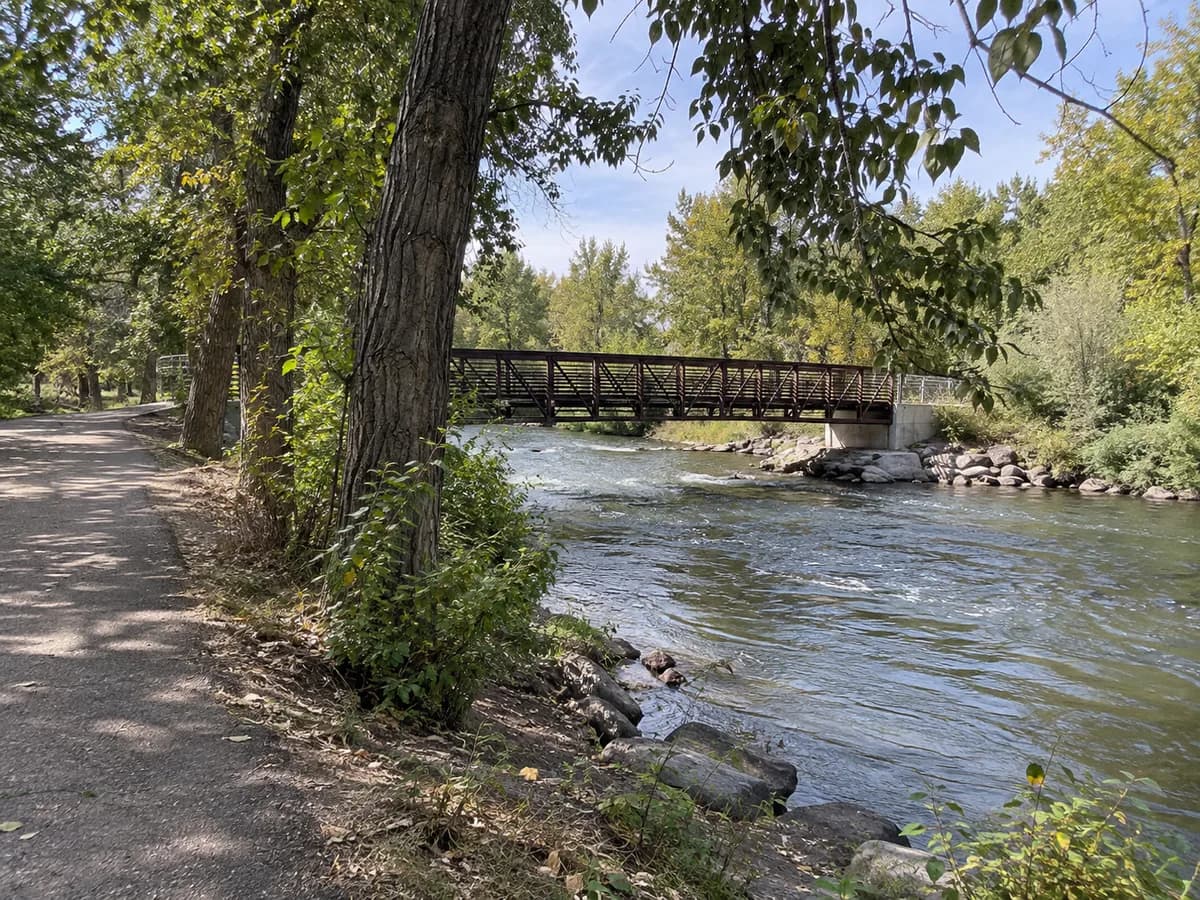 Greenbelt and footbridge scene inspired by the Boise River