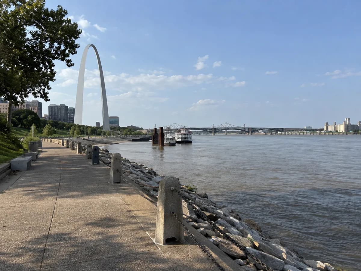 Riverfront path scene inspired by the Gateway Arch in St. Louis