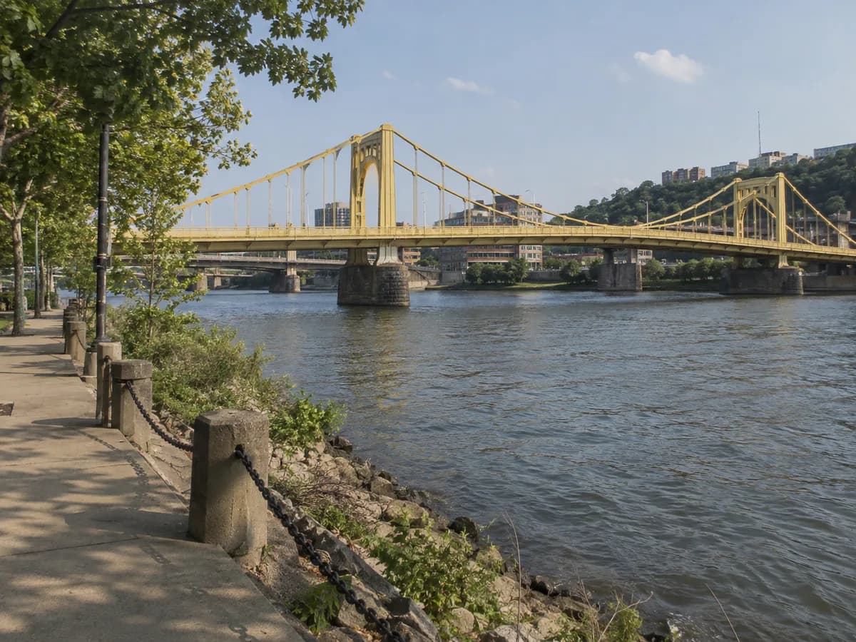 Riverside path and yellow bridge scene inspired by Pittsburgh