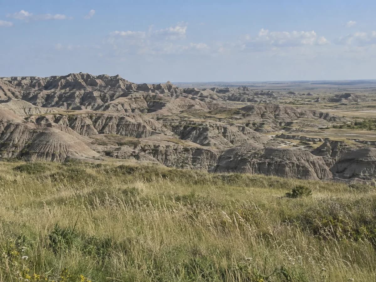 Prairie and rock formation scene inspired by Badlands National Park